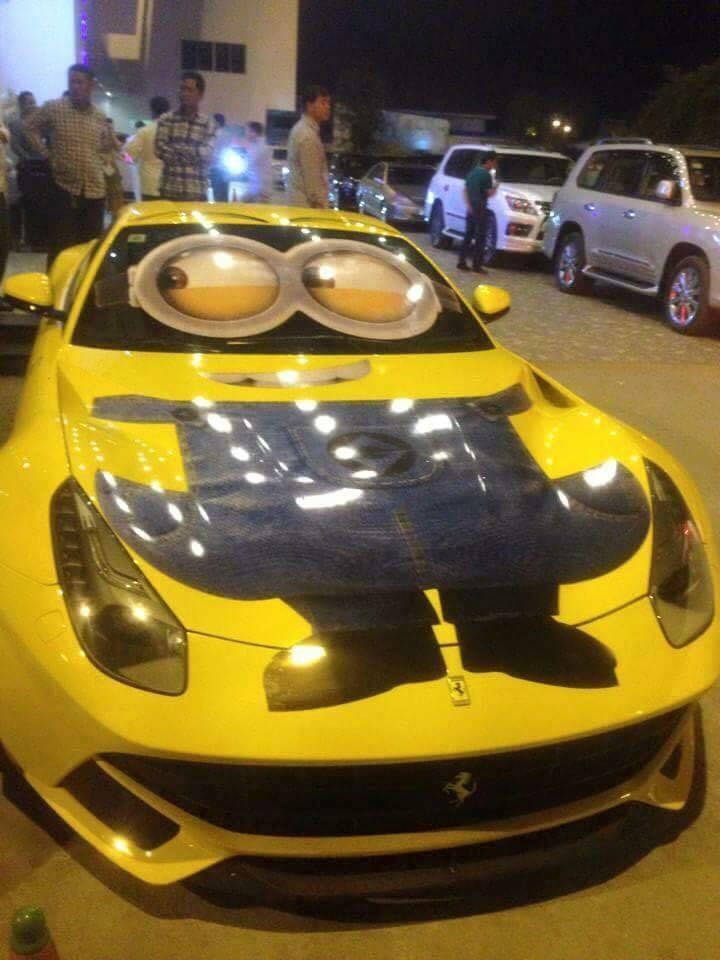 a yellow sports car is parked on the street