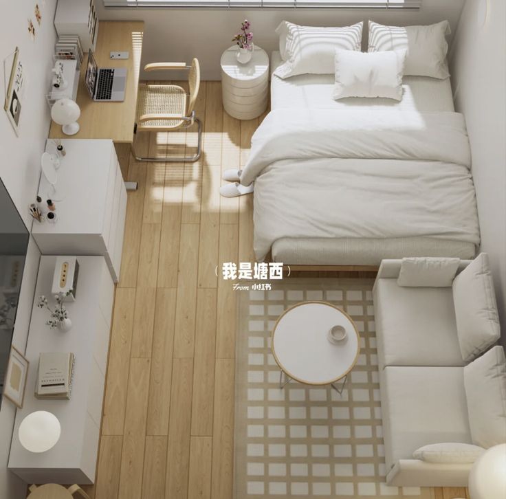 an overhead view of a bedroom with a bed, couch and desk in it's corner