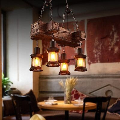 a wooden table with chairs and lights hanging from it