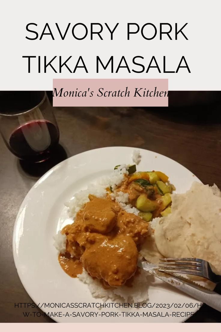 a white plate topped with food next to a glass of wine