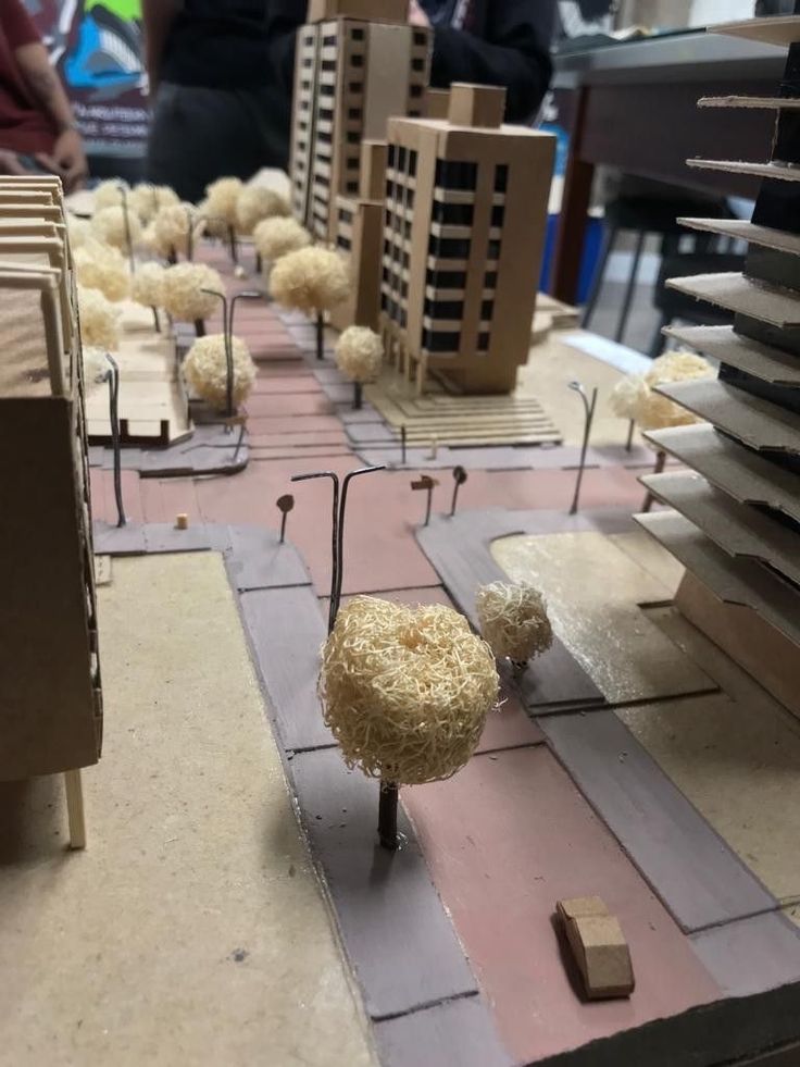 a table that has some fake buildings on it