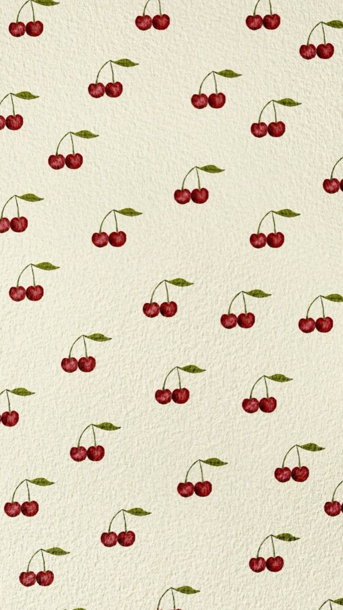 a white wall with cherries on it