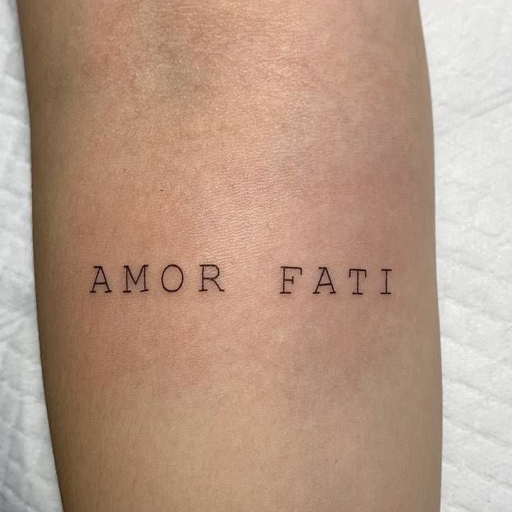 a tattoo that reads,'am or fati '