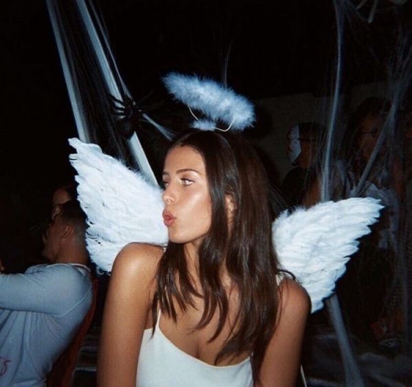 a woman with angel wings on her head