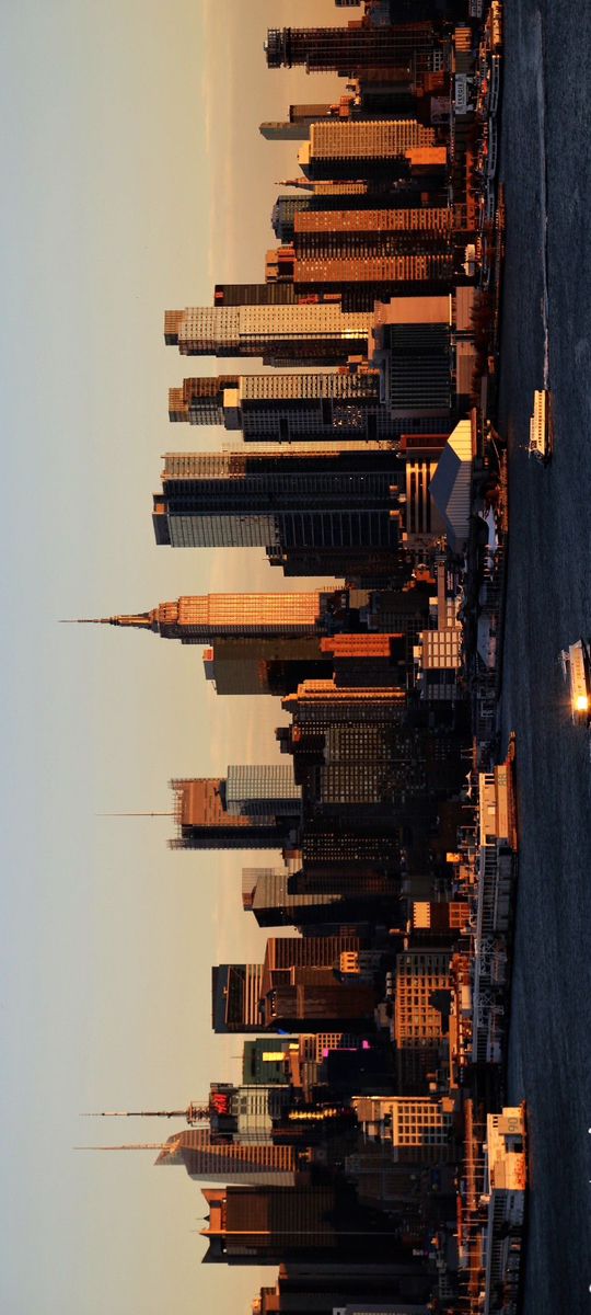 the skyline of new york city is shown from across the street