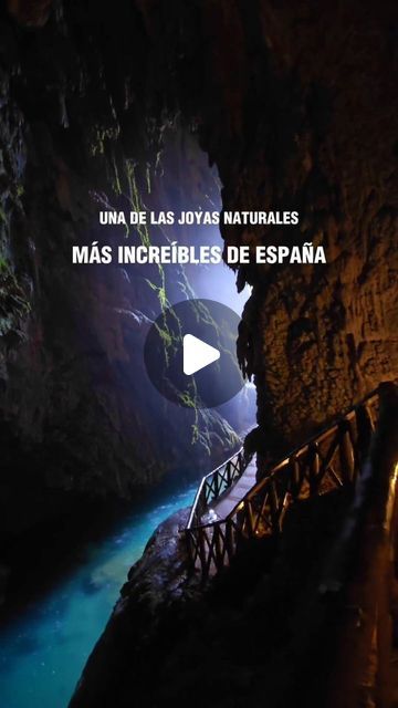 an image of the inside of a cave with stairs leading up to it and water below