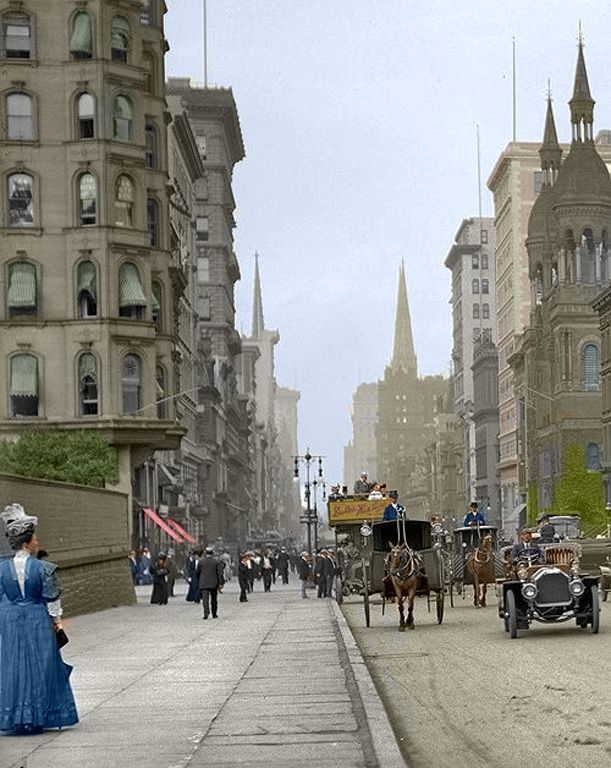 an old time street scene with horse and buggy in the foreground, buildings on either side