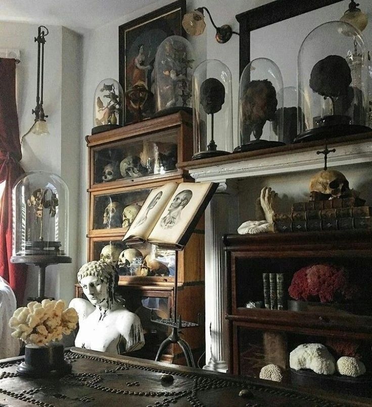 a room filled with lots of clutter on top of a wooden table