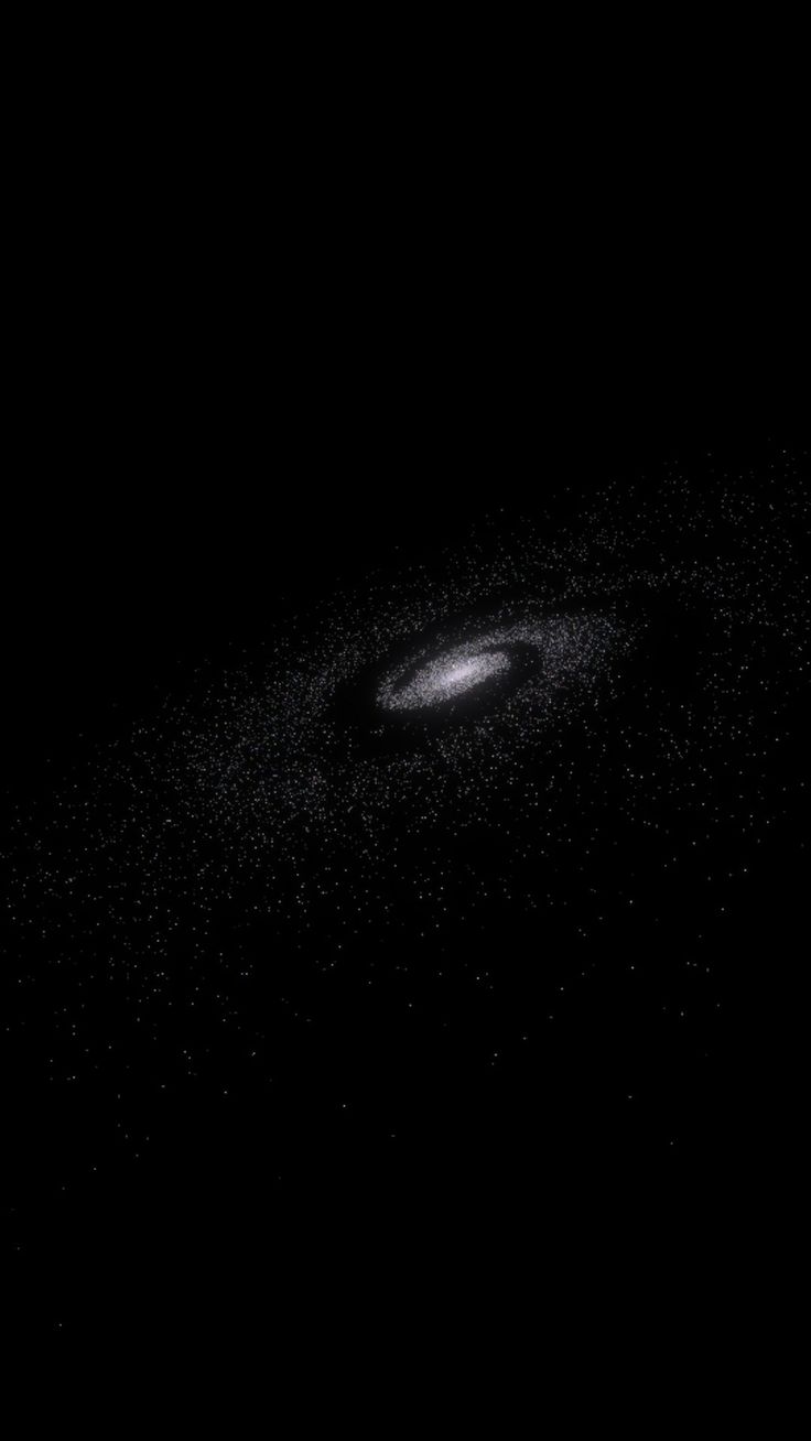 a black and white image of a disk in the dark sky with stars around it