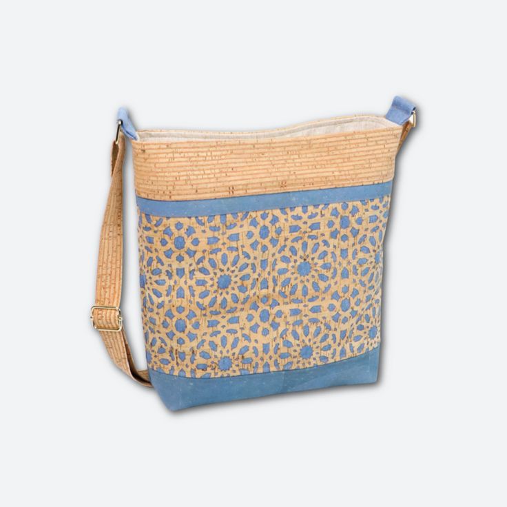 a blue and yellow purse with an animal print pattern on it's front pocket