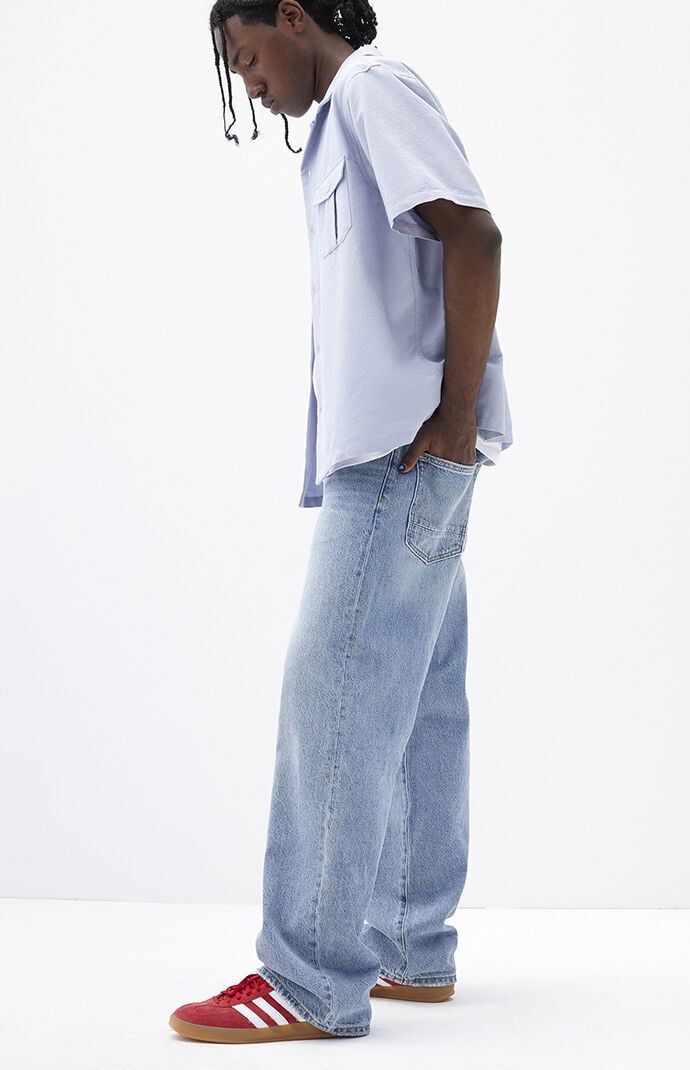 The PacSun Medium Indigo Baggy Jeans offer a classic relaxed fit with a wide leg and mid-rise design. Featuring a baggy fit from thigh through knee and an oversized wide leg opening, these jeans are completed with a zip fly closure, five-pocket body, and clean finish, making them a timeless choice for casual comfort and style.Model is wearing a size 32Model Measurements: 6'1” Height, 31” Waist, 32” Inseam PacSun Mens Medium Indigo Baggy Jeans - Blue size 29W 30L Trendy Pants Men, Blue Baggy Jeans Men’s Outfit, Shoes For Baggy Jeans, Light Wash Jeans Men, Men Baggy Jeans, Mens Baggy Jeans, Blue Jeans Outfit Men, Outfit Shuffles, Lau Lau