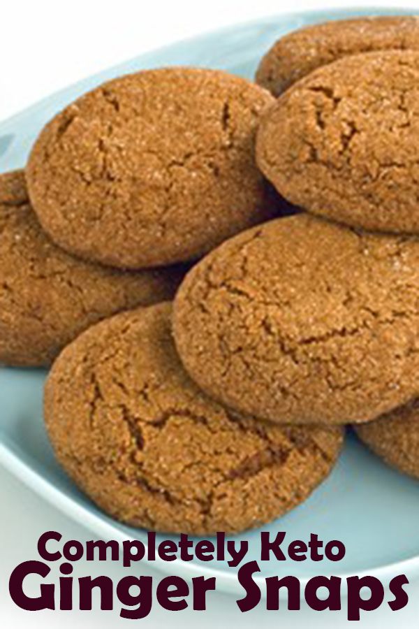 a plate full of cookies with the words completely keto ginger snaps