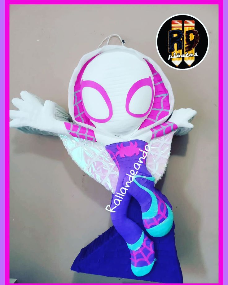 the doll is wearing purple and blue tights with spider - man on it's chest