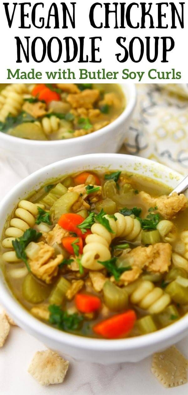 two white bowls filled with chicken noodle soup