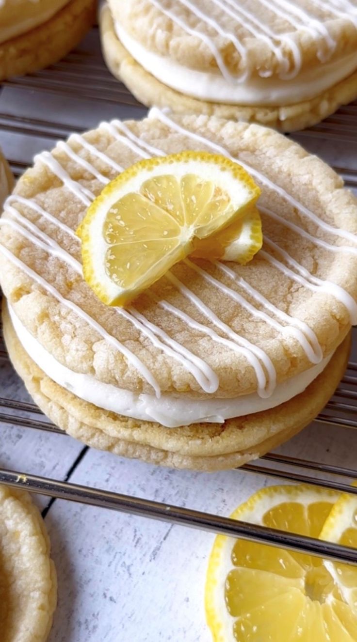 cookies with icing and lemon slices on cooling rack