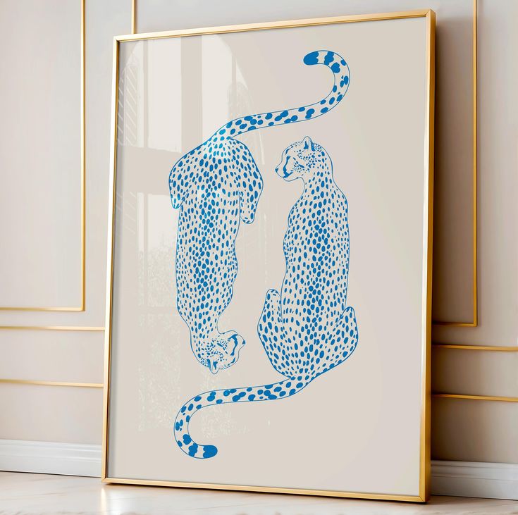 two cheetah are shown in blue ink on a white background with gold trim