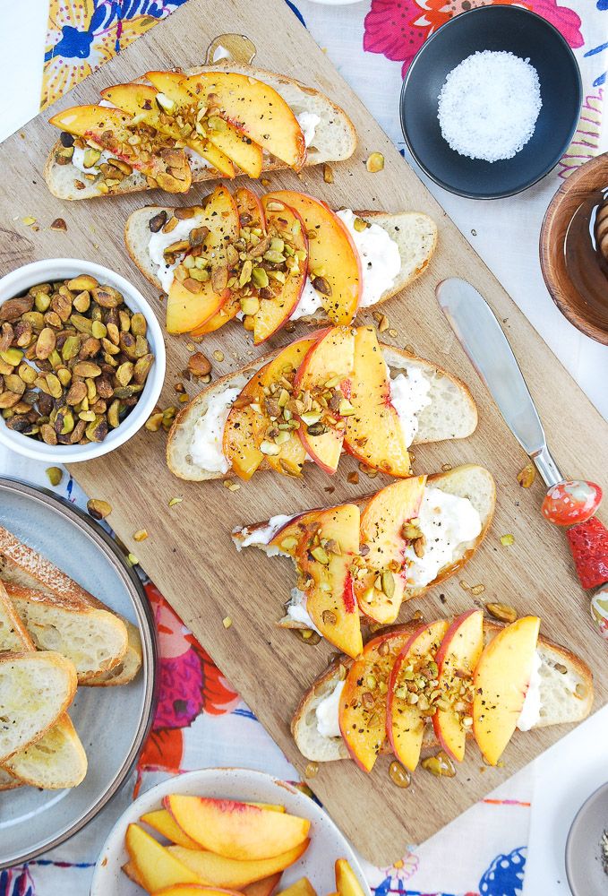 slices of bread with nuts and peaches on them