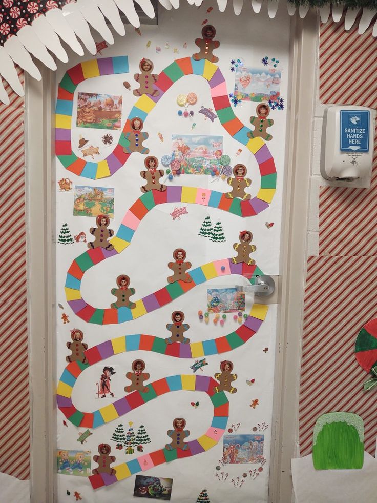 the door is decorated with gingerbreads and candy canes