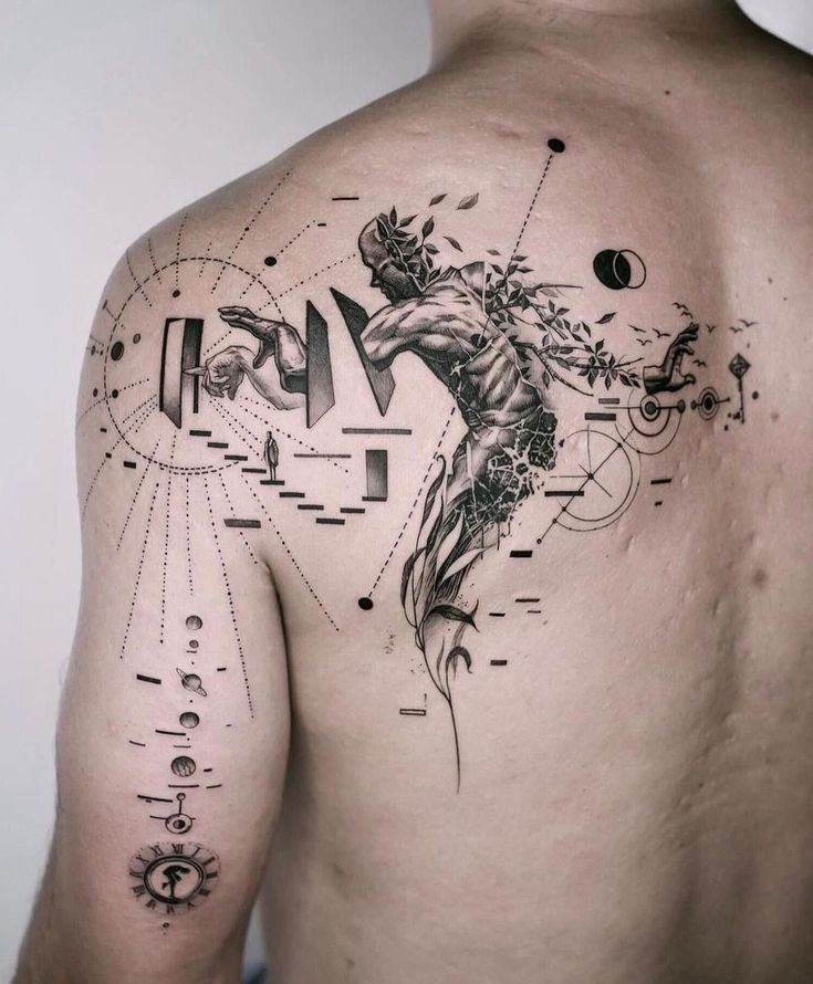 a man's back with an abstract tattoo design on his left shoulder and chest