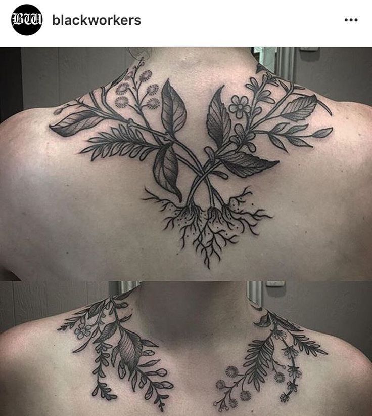 the back of a woman's neck with flowers and leaves on it, while she has