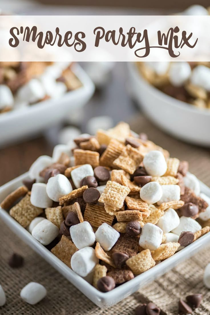 s'mores party mix in a square bowl with marshmallows and chocolate chips