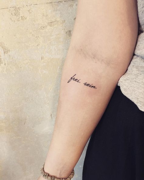 a woman's arm with a tattoo on it that says, i love you