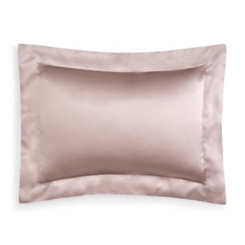 an image of a satin pillowcase with two pillows on the bottom and one in the middle