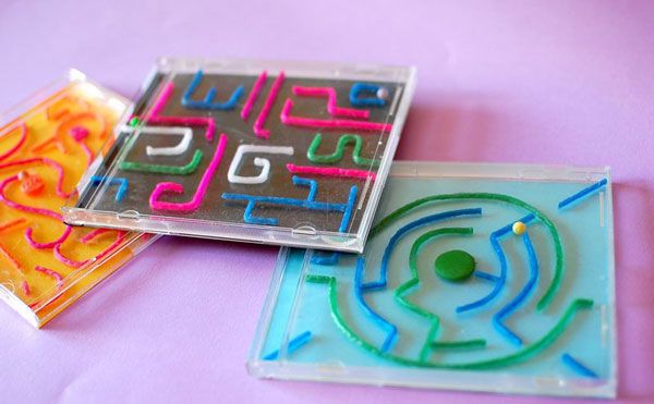 there are two pieces of plastic that have been made to look like mazes and numbers