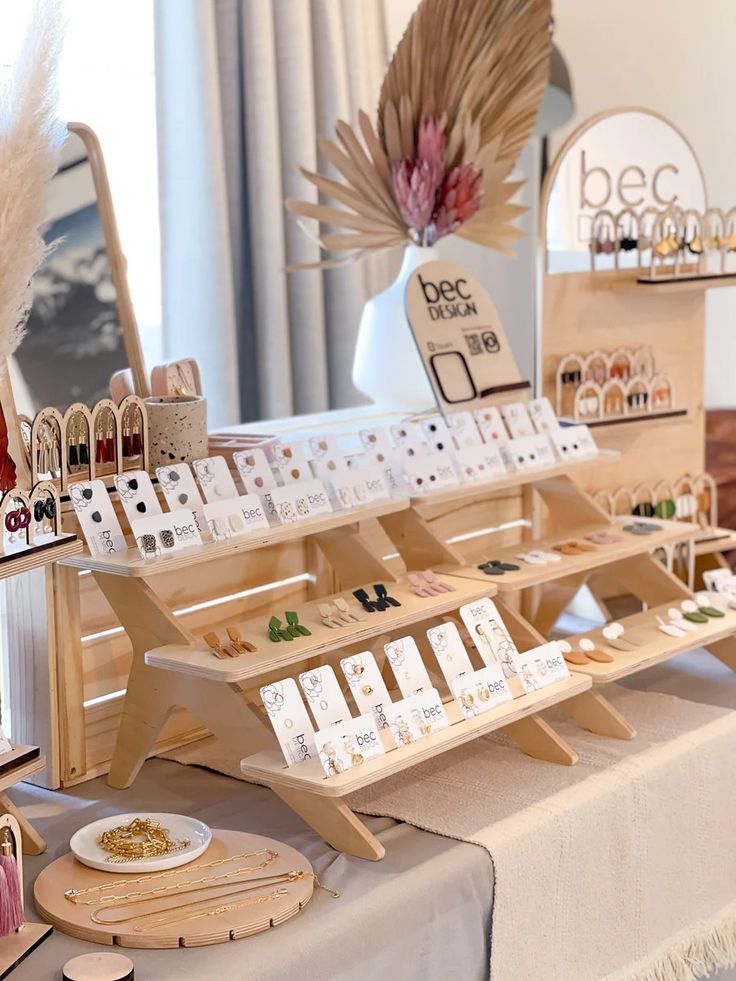 a table topped with lots of different types of items on display in front of a mirror