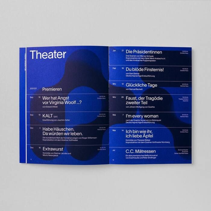 a blue brochure with the words theater in german on it's side