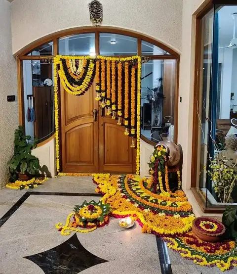 the entrance to a building decorated with flowers and garlands