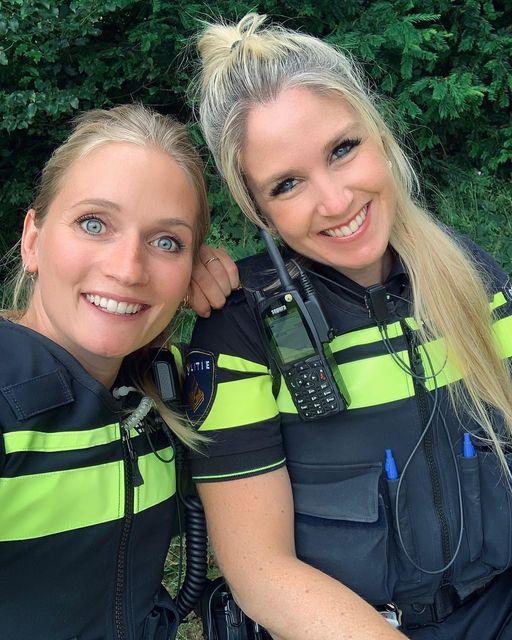 two women in scuba gear posing for a photo