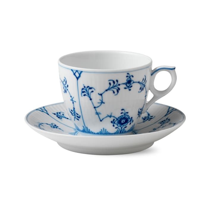 a blue and white tea cup with saucer