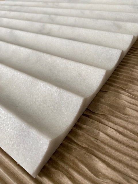 several pieces of white foam sitting on top of a wooden table