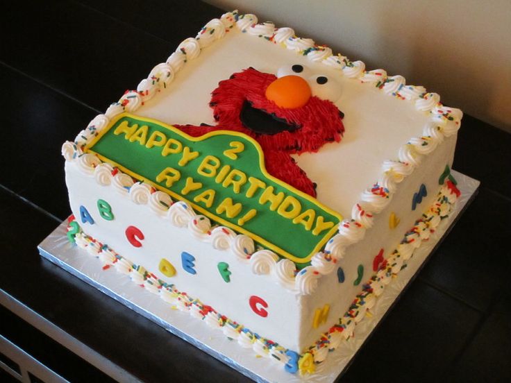 a birthday cake with an elmo face on it