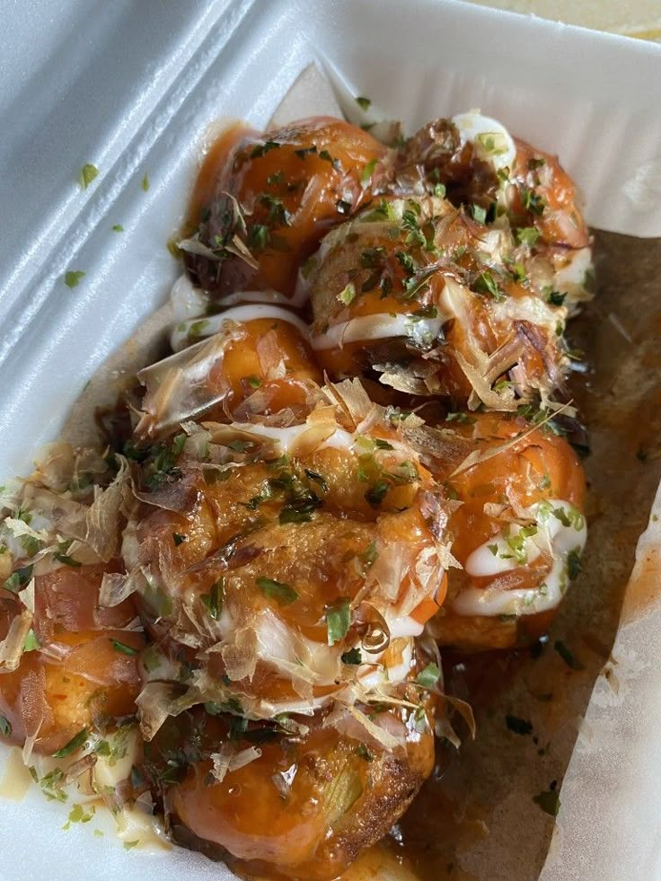 some food in a white container on a table