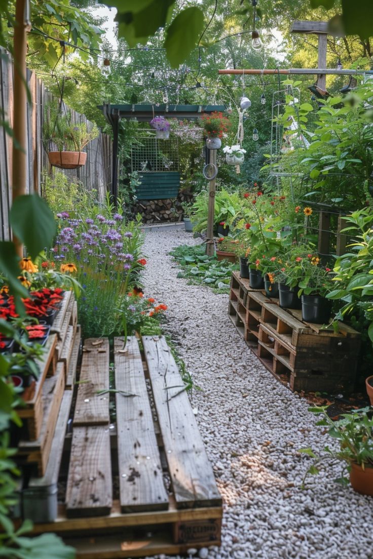 a wooden bench sitting in the middle of a garden filled with lots of plants and flowers