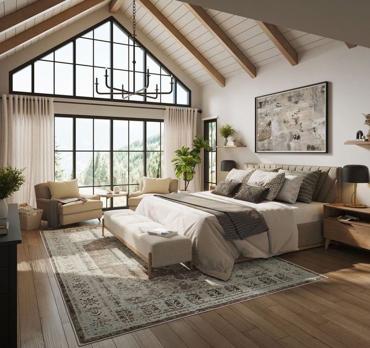 a large bed sitting in a bedroom on top of a wooden floor next to a window