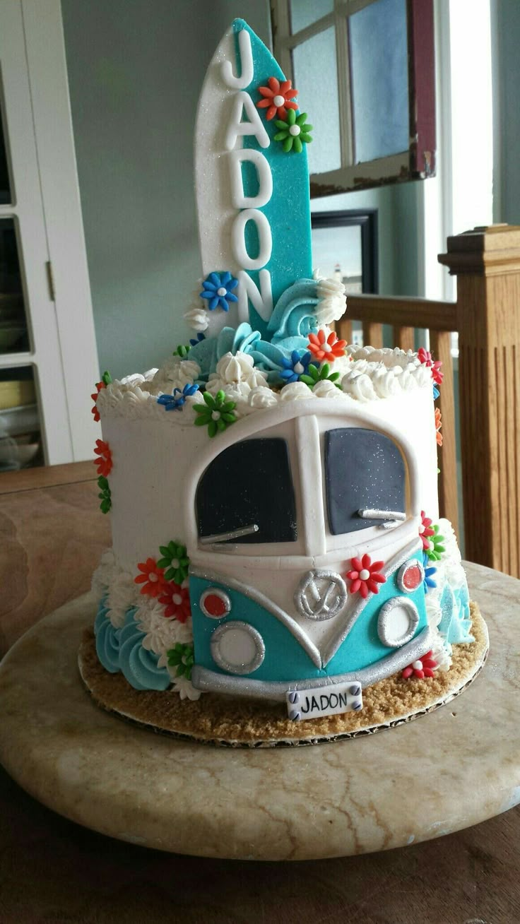 a birthday cake with a surfboard on top