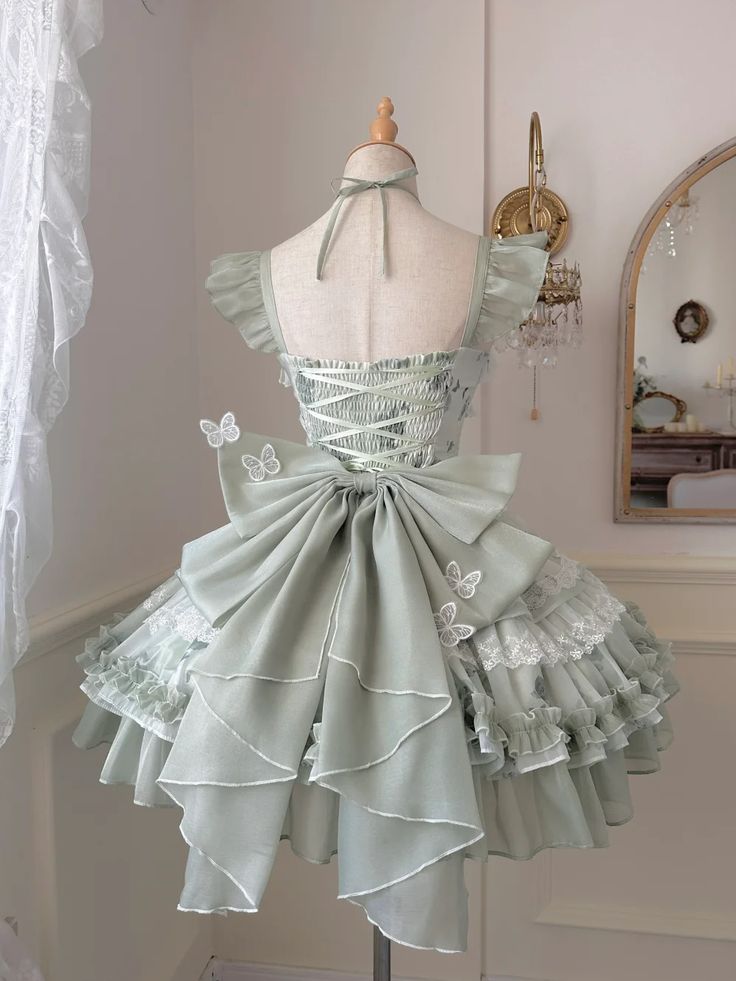 This exquisite piece captures the essence of whimsical elegance with its delicate floral patterns and ethereal butterfly accents. The dress features a comfortable shirred back and lace-up detailing, ensuring a perfect fit for any princess. Ideal for tea parties, cosplay events, or simply embracing your inner fairy, let your imagination take flight and transform into a fairy butterfly princess with every wear. SizeXSSMLXLFull Length78.58081.58384.5Waist6064687276Bust7680848892 Fairycore Sleeveless Dress For Garden Party, Spring Fairycore Fairy Dress With Ruffles, Fairycore Ruffled Fairy Dress For Spring, Spring Fairycore Dress With Ruffles, Fairycore Sleeveless Corset Dress With Ruffles, Fairycore Fairy Dress With Ruffles For Garden Party, Fairycore Ruffled Fairy Dress For Garden Party, Summer Fairycore Fairy Dress With Lace Trim, Fairy Style Sleeveless Dress For Garden Party