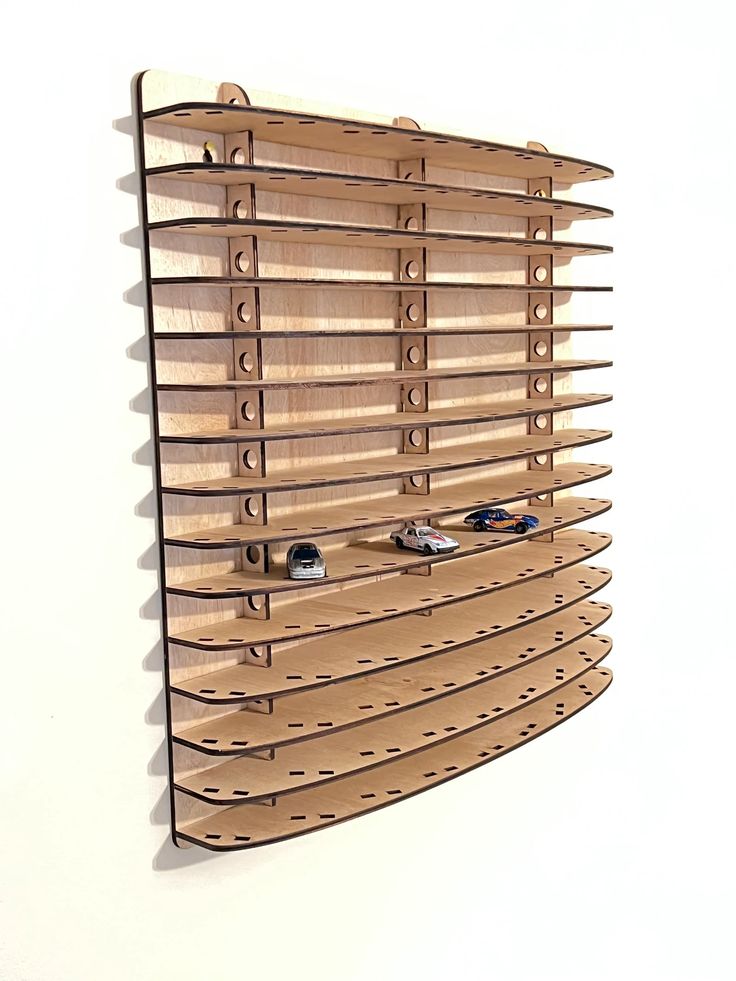 a wall mounted wooden shelf with several pairs of shoes on the bottom and below it