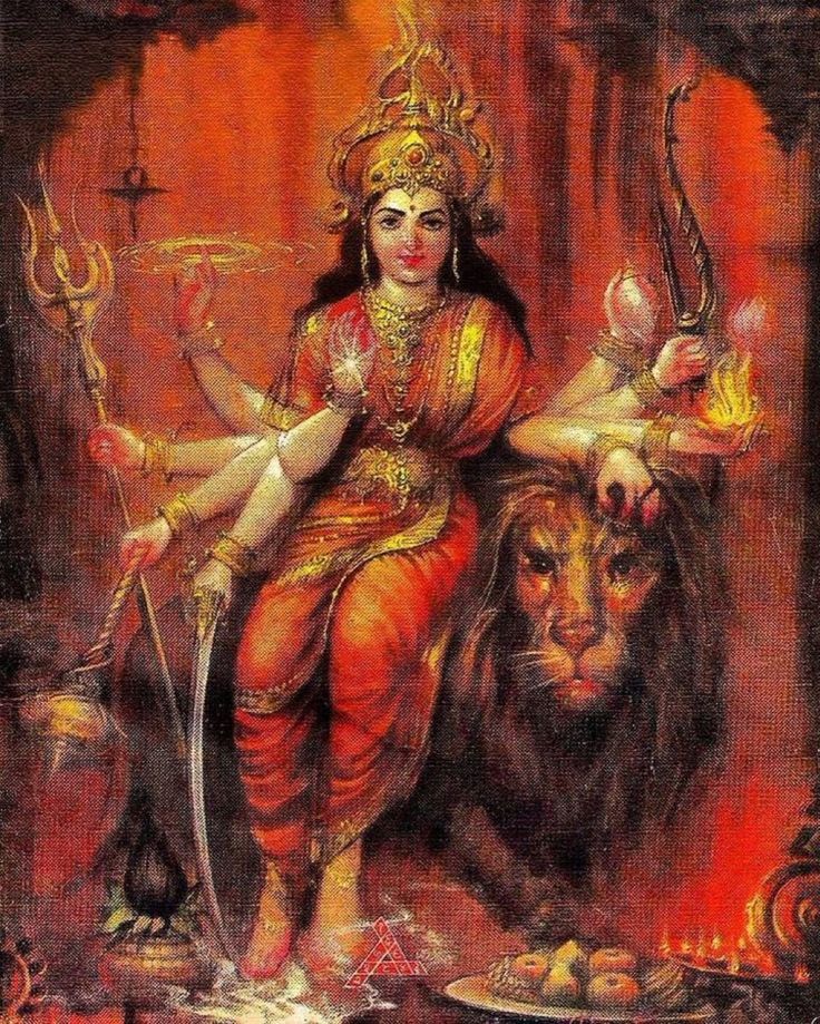 the hindu goddess sitting on top of a lion