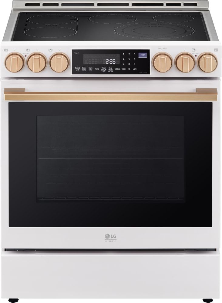 a white stove top oven with two burners and an electronic timer on the front