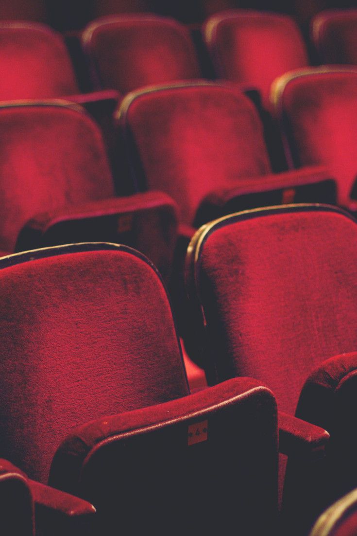 red seats with the words berlin's 7 most intriguing cinemas in front of them