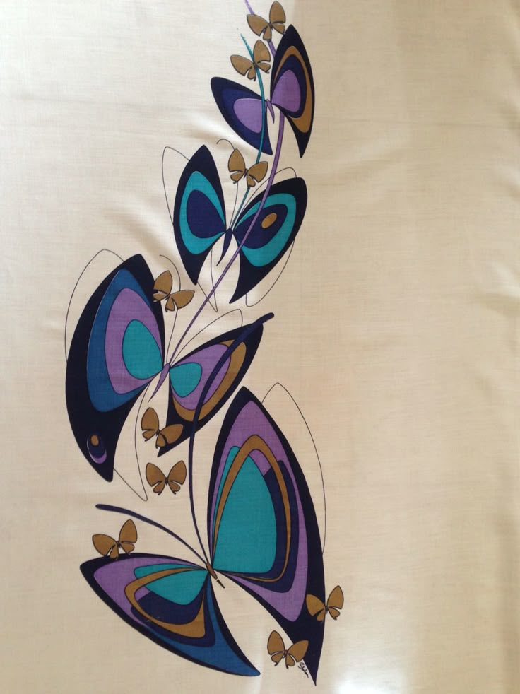 an artistically designed wall hanging with blue and purple butterflies