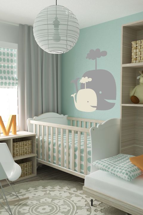 a baby's room with an elephant decal on the wall and a crib