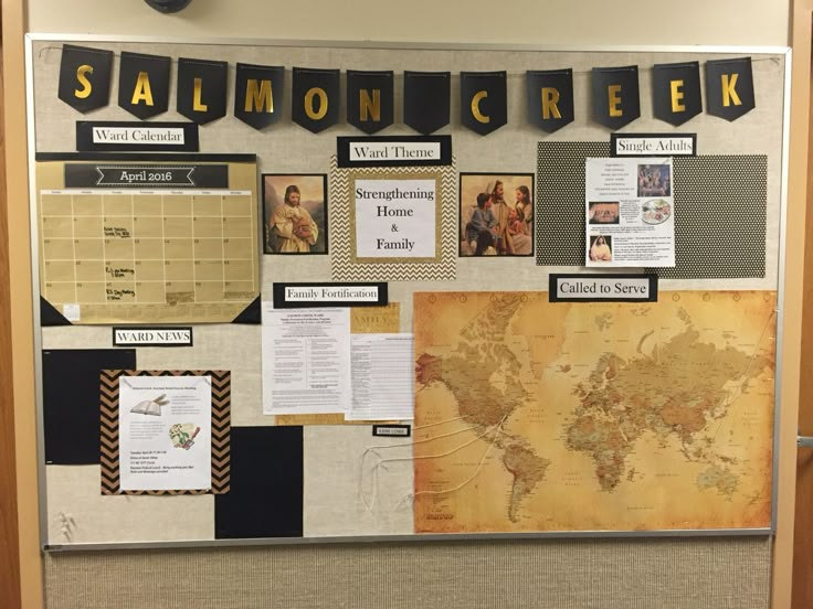 a bulletin board is covered with papers and other items that are on display in the classroom