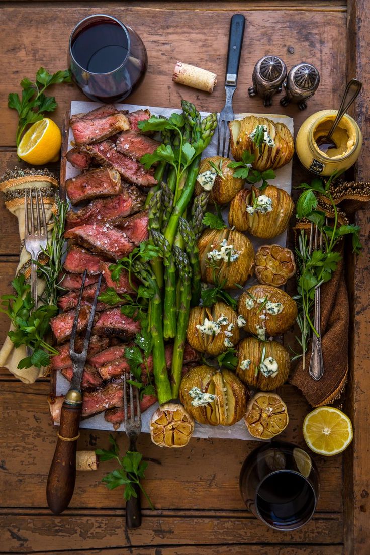 a table topped with lots of different types of food and utensils on top of it