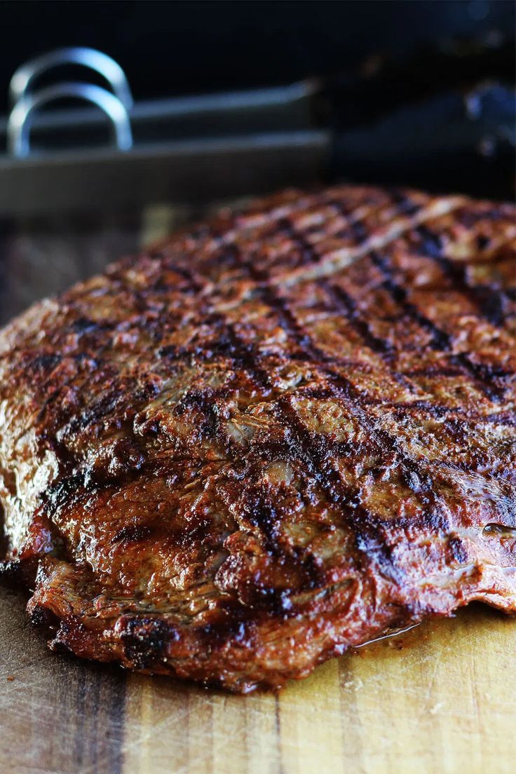 grilled steak on a wooden cutting board with text overlay