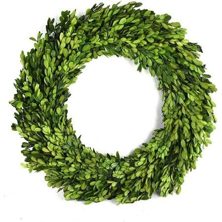 a wreath with green leaves is shown against a white background and looks like it could be used as an ornament